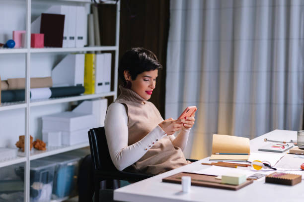 istock Latin Woman Texting On Her Smartphone 1417441801