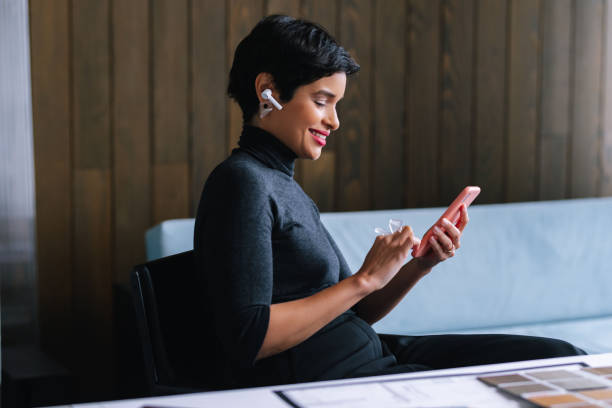 istock Woman Texting On Her Smartphone In Her Home Office 1417441865