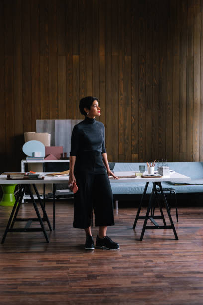 istock Latin Woman Standing In Her Office 1417441868