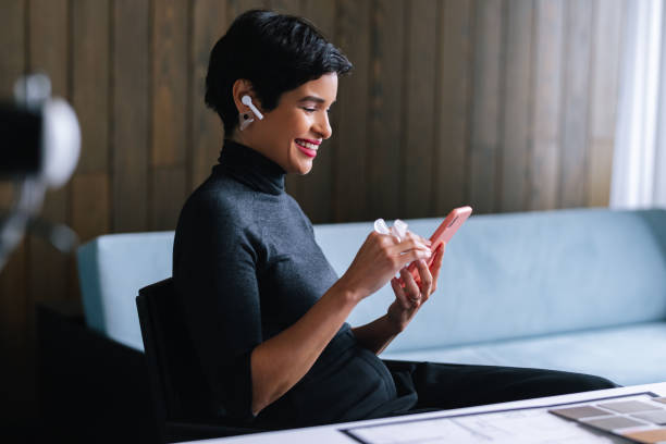 istock Woman Texting On Her Smartphone In Her Home Office 1417441874