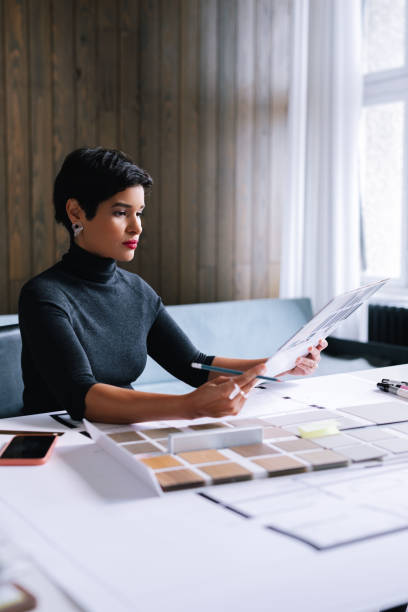 istock Businesswoman Choosing A Colour From A Palette 1417441904