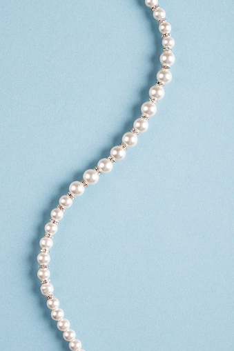 String of pearls on a white background.