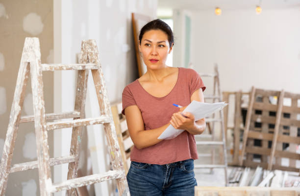 istock Female engineer matching check list during repair works 1417457775