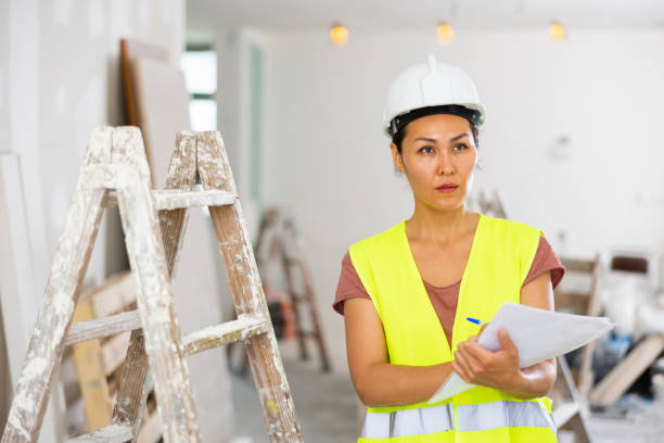 istock Female engineer matching check list during repair works 1417458373