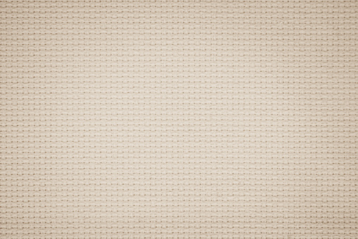 Fabric canvas woven texture background in pattern in light beige cream brown color blank. Natural gauze linen, carpet wool and cotton cloth textile as sack material clean empty for decoration text.