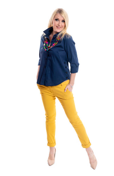 It's never too late to try something new, for example being a fashion model Mature blond woman posing with confidence over white background in studio. too thin stock pictures, royalty-free photos & images