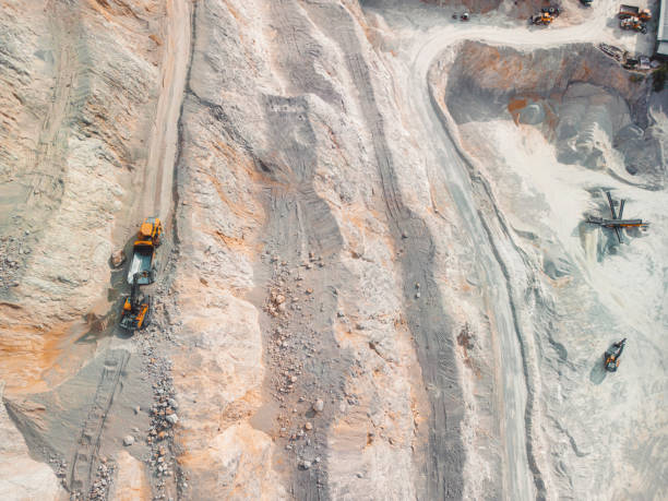 istock Top down view of excavator loading dump truck on the quarry terraces 1417470544