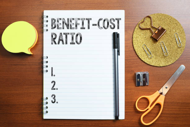 istock Conceptual caption Benefit Cost Ratio. Business approach Relationship between the costs and benefits of project Woman Holding Note With Important News And Pointing On It With Pen. 1417471625