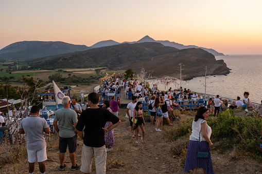 Gökçeada, Çanakkale, Turkey, August 17,2022:Sunset at Gökçeada İsland.Tourists watching the sunset.