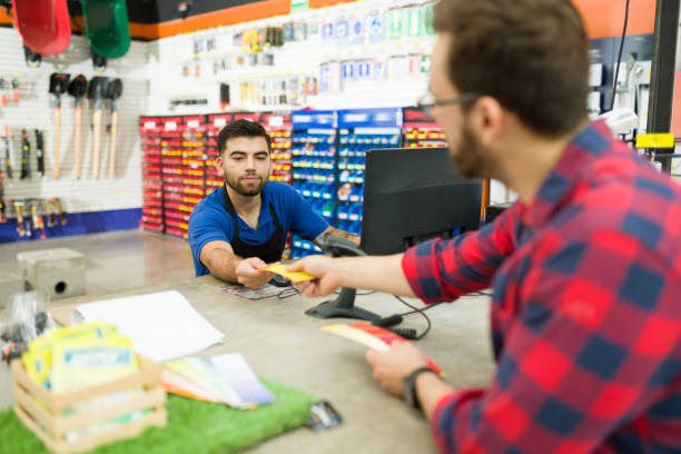 istock Male customer paying for his shopping at the hardware store 1417478800