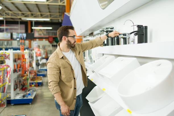 istock Customer looking at the bathroom faucets at the hardware store 1417479476