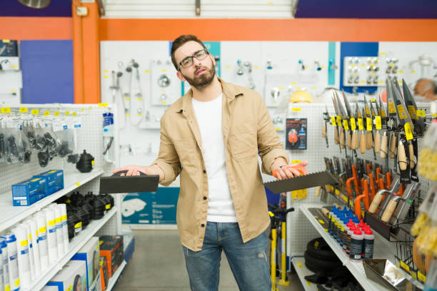 istock Worried customer feeling stressed while buying paint brushes 1417479559