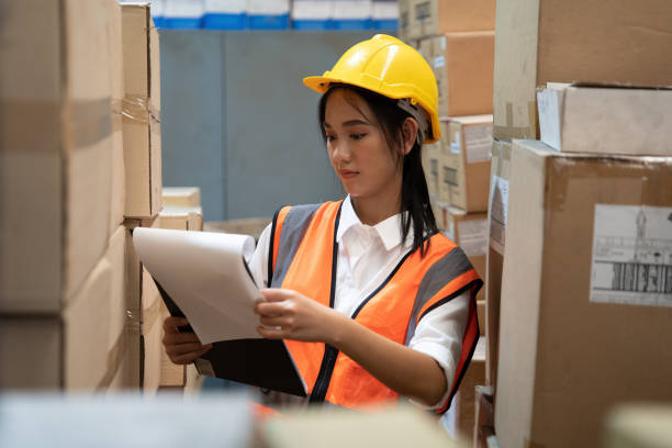 istock in the warehouse factory standing arrange the boxes on shelf 1417485044
