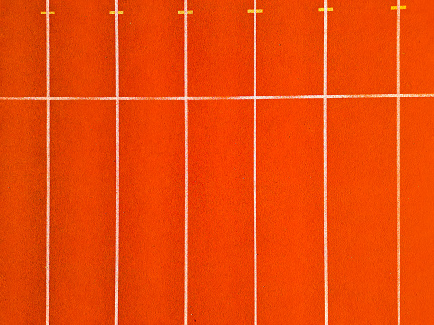Aerial drone view of a red running track.