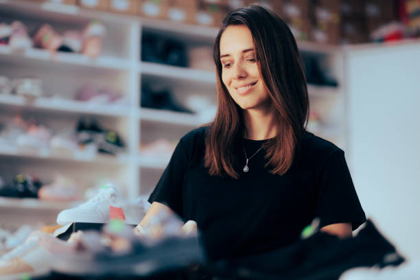 istock Beautiful Shop Assistant Working in a Shoes Store 1417501712