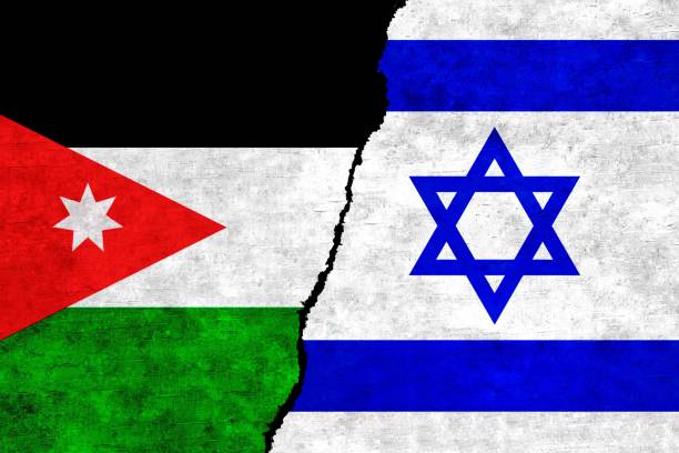 istock Israel and Jordan flags on a wall with a crack. Israel vs Jordan image 1417506859