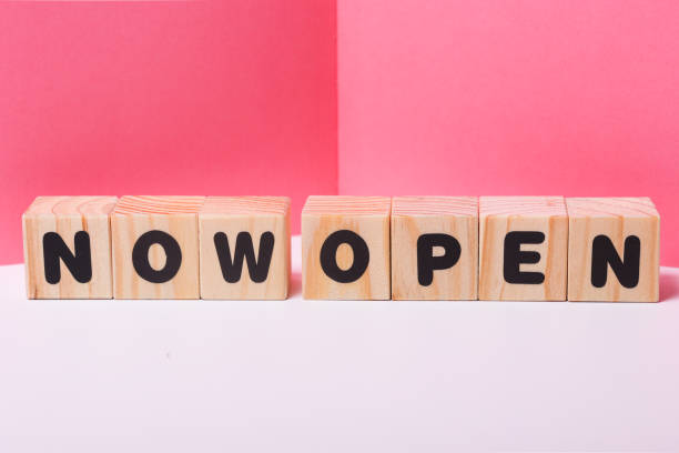 istock NOW OPEN  word on wooden cubes 1417509266
