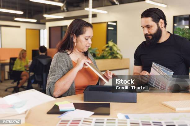Male And Female Aboriginal Australian Designers Collaborating Stock Photo - Download Image Now