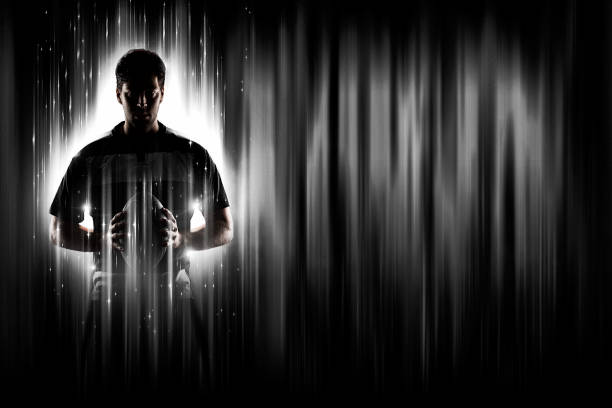 Rugby Player with a white uniform on a black and white background looking like a super hero.