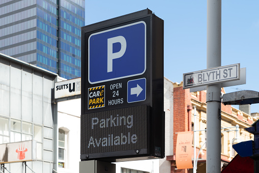 Adelaide, Australia - August 23, 2022: Parking Available, open 24 hours CarE Park Road Sign in Hindley Street, South Australian CBD
