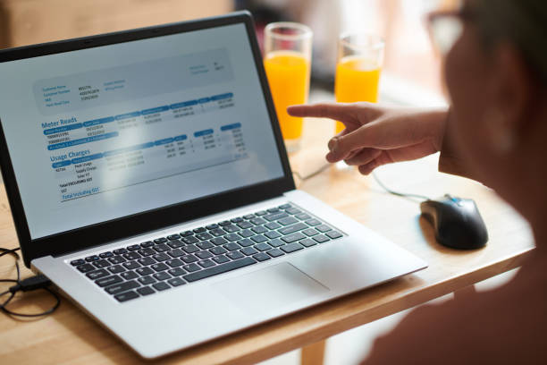 istock Grandson Helping to Pay Utility Bills Online 1417518054