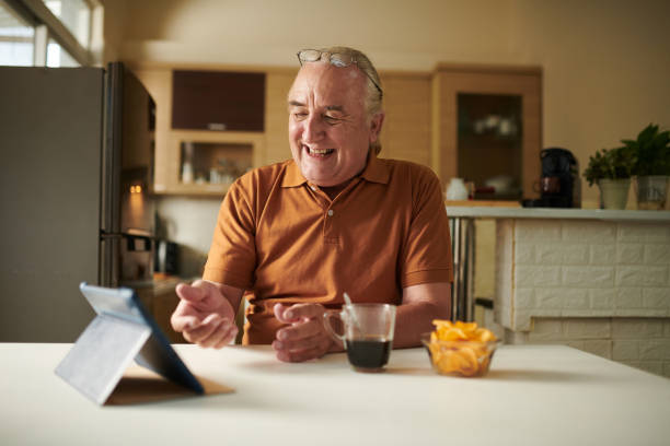 istock Elderly Man Video Calling Friend 1417519694
