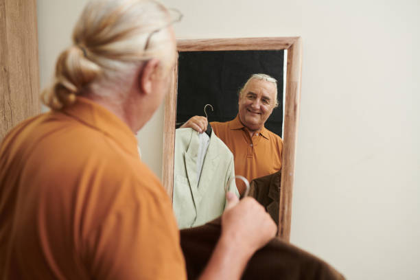 istock Senior Man Deciding What to Wear 1417519732