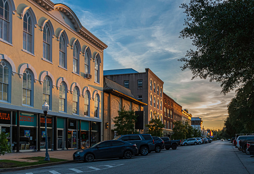 Eufaula, Alabama, USA - August 13, 2022: Dramatic view of historic buildings in downtown Eufaula in golden hour lighting.