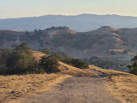 Two hikers make their way on the Short Ridge trail in Sycamore Valley Open Space Preserve