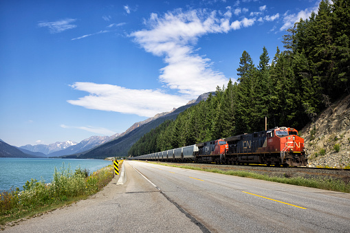 Moose Lake and CN Freight Train in Mount Robson Provincial Park, BC, Canada in summer.