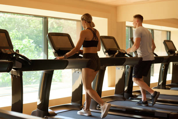 istock People training on treadmill in gym 1417533767