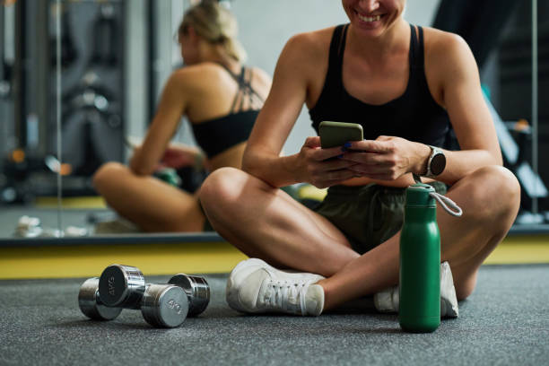 istock Woman resting in gym after training 1417533911