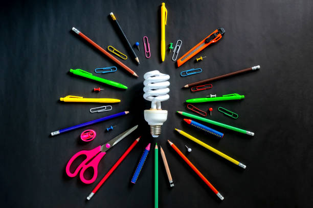 istock Top view Light bulb and various stationery on grey background. Idea education concept. 1417534561