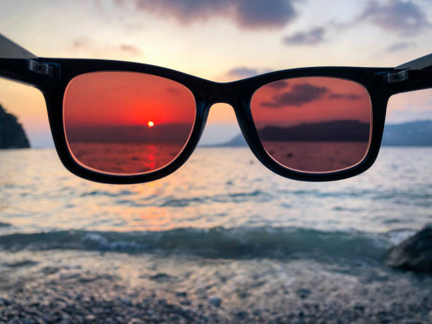 istock Sunglasses and sunset view on the beach. 1417543065