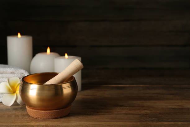 istock Composition with golden singing bowl on wooden table, space for text 1417543347