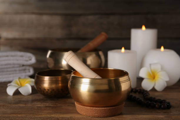 istock Composition with golden singing bowls on wooden table 1417545571