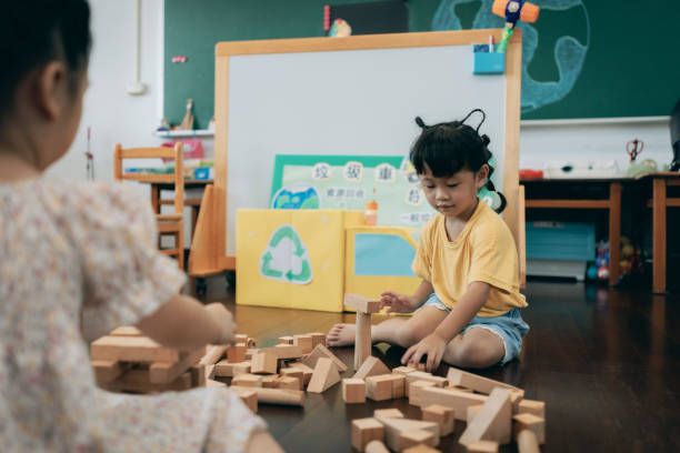 istock Preschool children playing with teaching aids in classroom 1417548059