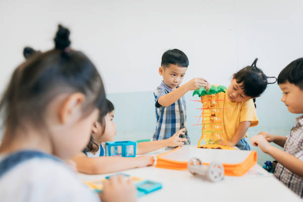 istock Preschool children playing with teaching aids in classroom 1417548087