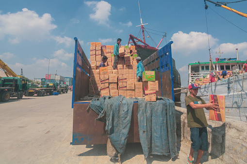 Jakarta, Indonesia - May 26, 2021: A worker at the Sunda Kelapa port