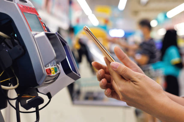 istock Paying with smart phone at grocery store 1417555834