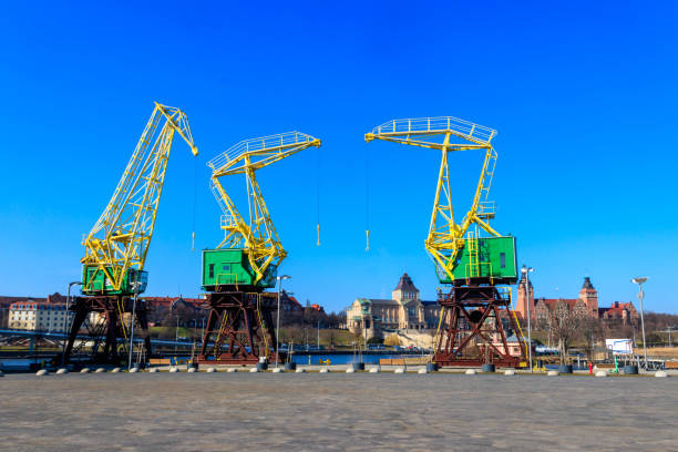 istock Old cranes on city boulevard in Szczecin, Poland 1417558176