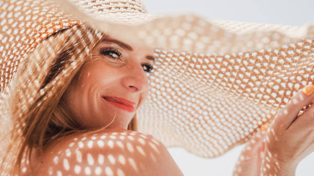 istock Smilling woman in a straw hat on vacation 1417559490