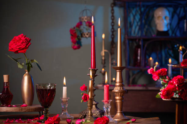 istock magic potion with red roses and burning candles in dark room 1417559644