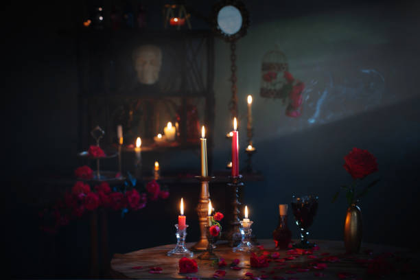 istock magic potion with red roses and burning candles in dark room 1417559655