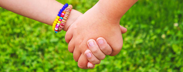istock The children put their hands together. Selective focus. 1417560052