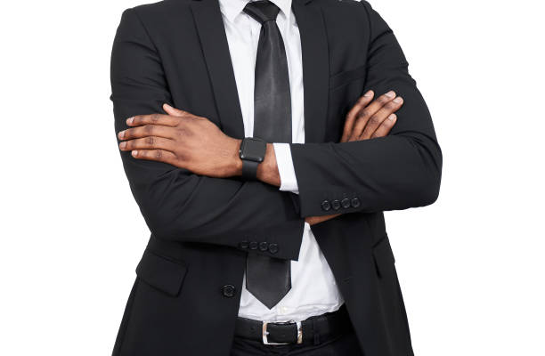 istock African american businessman standing isolated over white background happy face smiling with crossed arms looking at the camera. Positive person. 1417560077
