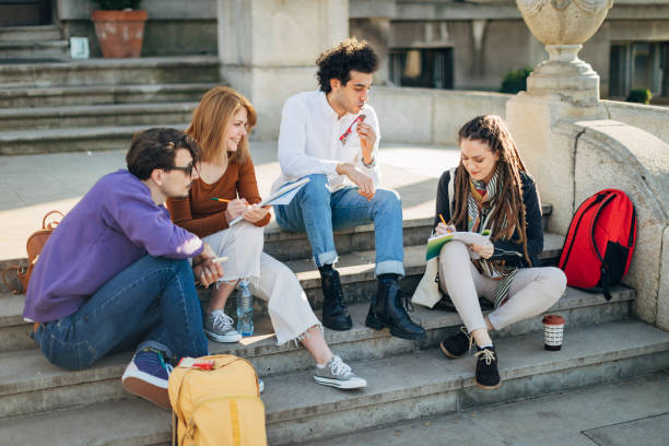 istock A group of students study together while sitting on the steps. They drink coffee from disposable cup 1417562062