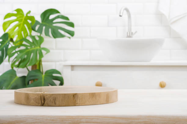 istock Round wooden podium for product display on blurred bathroom background 1417563485
