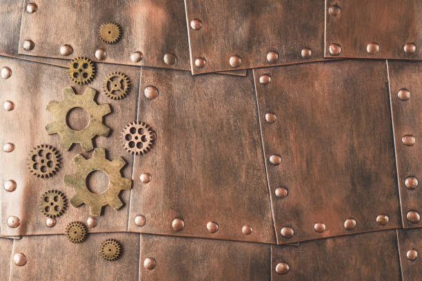 istock Gears on copper metallic plates with copy space. Steampunk background 1417564056
