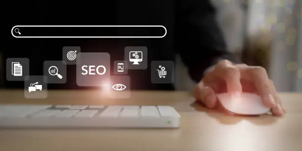 Photo of SEO, Search Engine Optimization ranking concept.  Digital marketing strategy of promote traffic to website. Working on computer with the icon of online search engine, abbreviation SEO and SEO symbol.
